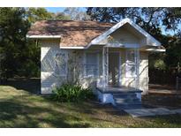 Charming single-story home with a cozy front porch and well-maintained lawn at 1496 33Rd Nw St, Winter Haven, FL 33881