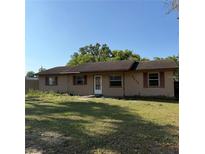 Charming single story home featuring a well-maintained lawn and a classic exterior with shuttered windows at 3640 Chart Prine Rd, Lakeland, FL 33810