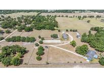 Vast horse property featuring riding arena and paddocks at 25601 Hutcheson Ln, Sorrento, FL 32776