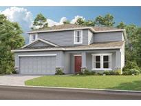 Charming two-story home featuring a two-car garage, gray siding, and a well-manicured lawn at 2038 Babbling Brook Blvd, Auburndale, FL 33823