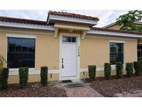 Charming single-story home featuring a red tile roof and tidy landscaping at 1758 Coriander Dr # 1758, Poinciana, FL 34759
