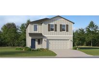 Charming two-story home with attached two-car garage and well-manicured landscaping at 1397 Acorn Meadow Loop, Eustis, FL 32726