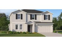 Charming two-story home featuring a two-car garage, black shutters and inviting front yard at 1313 Hammock Reserve Dr, Deland, FL 32720