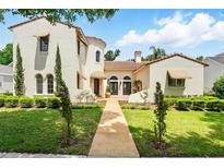 Stunning two-story home with a tile roof and a beautifully landscaped front yard at 1239 Roycroft Ave, Kissimmee, FL 34747