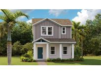 Charming two-story home with gray siding, white trim, a welcoming porch, and lush landscaping at 606 Terrapin Dr, Debary, FL 32713