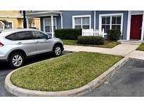 Charming townhome with neat landscaping and parking, offering a welcoming curb appeal at 2605 Gala S Rd, Kissimmee, FL 34746