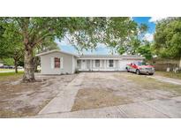 Charming single-story home with a well-maintained front yard and a cozy porch at 995 Merrimac St, Deltona, FL 32725