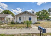 Charming single-story home with a well-manicured lawn, sidewalk, and a mailbox in a sunny neighborhood at 701 N Vermont Ave, Lakeland, FL 33801