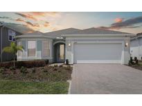 Charming single-story home with a well-manicured front yard and inviting curb appeal at 2797 Top Hill Ct, Minneola, FL 34715