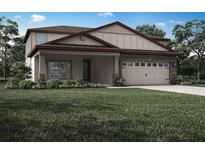 Charming two-story home with stone accents, a welcoming front porch, and attached two car garage at 3339 Chinotto Dr, Lake Alfred, FL 33850