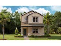 Charming two-story home with a well-manicured lawn and inviting front porch at 612 Terrapin Dr, Debary, FL 32713