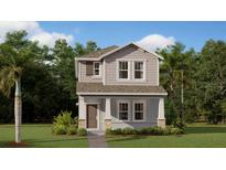 Charming two-story home with gray siding, covered porch, and well-manicured lawn at 614 Terrapin Dr, Debary, FL 32713