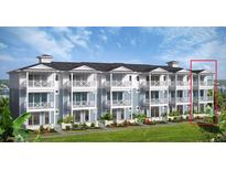 Beautiful exterior elevation showing multiple units with blue accents, white trim, and manicured landscaping at 23 Marden Dr # 51, Ormond Beach, FL 32176