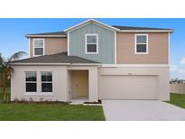 Inviting two-story home featuring a two-car garage, well-maintained lawn, and a charming light yellow front door at 1046 Foreshore Ln, Haines City, FL 33844