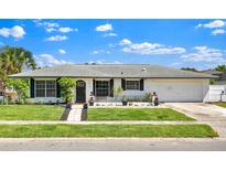 Charming single-story home featuring well-kept landscaping and a welcoming front entrance at 1913 Poinsetta Ln, Maitland, FL 32751