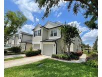 Beautiful townhouse with manicured lawn, driveway and attached garages in a desirable neighborhood at 6059 Twain St # 108, Orlando, FL 32835