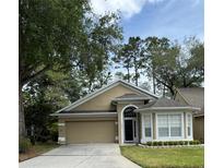 Charming single-Gathering home with well-manicured lawn and two-car garage at 1608 Fox Glen Ct, Winter Springs, FL 32708