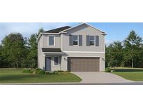 Charming two-story home with a two-car garage, landscaped yard, and neutral color palette at 970 Hour Glass Rd, Lakeland, FL 33801