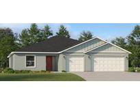 Charming single-story home with a two-car garage, well-maintained lawn, and welcoming curb appeal at 2115 Forage Dr, Kissimmee, FL 34746
