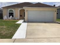 Charming single-Gathering home with a well-maintained lawn and two-car garage at 2057 Swift Rd, Oviedo, FL 32766