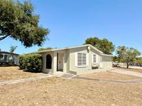 Charming single-story home featuring a well-maintained lawn and mature trees at 2201 Flamingo Ave, Deltona, FL 32738