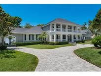 Stately two-story home features a beautiful front yard and a circular driveway at 5500 W Lake Butler Rd, Windermere, FL 34786