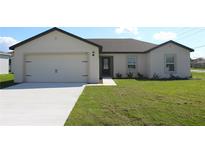 Charming single-Gathering home with well-manicured lawn and inviting front entrance at 181 Cimarron Ln, Poinciana, FL 34759