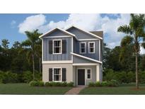 Charming two-story home with blue siding, gray accents, and a welcoming front entrance at 2879 Transformation Way, Clermont, FL 34714