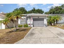 Charming single-story home featuring a well-maintained yard and a two-car attached garage at 640 Lake Dexter Cir, Winter Haven, FL 33884