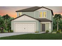 Charming two-story home with a two-car garage, landscaped yard, and classic architectural details at 9052 Wildlight Trl, Wildwood, FL 34785