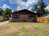 Charming single-story home with brick facade and unique window decorations at 2610 Tennessee Rd, Lakeland, FL 33815