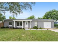 Charming one-story home with a well-manicured lawn and attached one-car garage at 14464 Sw 34Th Terrace Rd, Ocala, FL 34473