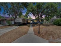 Charming home with mature trees and long driveway with RV parking in front yard at 750 Azalea Dr, Bartow, FL 33830