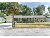 Charming single-story home features a well-manicured front lawn and an inviting facade at 781 Little Pine Dr, South Daytona, FL 32119