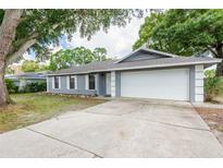 Charming single-story home with a two-car garage and well-maintained landscaping, creating a welcoming curb appeal at 5926 N Fork Ct, Lakeland, FL 33809