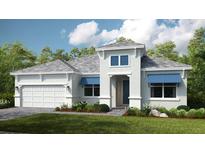 Inviting two-story home with a manicured lawn, two car garage and charming architectural details at 5653 Nevis Ter, Kissimmee, FL 34758