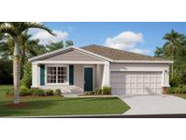 Charming single-story home with landscaped front yard and attached two-car garage at 7656 Gemstone St, Groveland, FL 34736