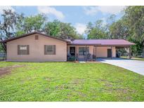 Charming single-story home with manicured lawn and inviting front porch at 3646 Palm Rd, Lakeland, FL 33810