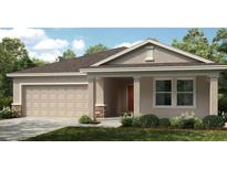 Charming single-story home with a two-car garage and a welcoming covered entryway at 2415 Slippery Rock St, Auburndale, FL 33823