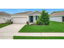 Charming single-Gathering home with well-manicured lawn and freshly landscaped front yard at 800 Reggie Rd, Winter Haven, FL 33884