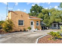 Charming stucco home with a well-manicured front yard and a cozy, inviting appearance at 1852 E Fern Rd, Lakeland, FL 33801
