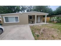 Charming single-story home with a neutral color scheme and a small front porch area at 312 Dorothy Ave, Daytona Beach, FL 32117