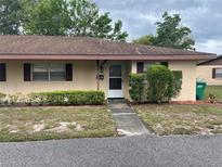Charming home featuring a well-kept lawn, inviting front door and complementary exterior paint at 42 Villa Villar Ct # 420, Deland, FL 32724