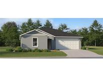 Charming one-story home featuring a two-car garage, a well-manicured lawn, and clean, neutral-colored stucco at 1163 Hour Glass Rd, Lakeland, FL 33801