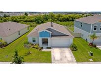Charming one-story home with a well-manicured lawn and inviting two-car garage, perfect for suburban living at 5933 Slate Rock Dr, Lakeland, FL 33811