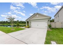 Charming single-Gathering home featuring a two-car garage and a scenic lake view at 3333 Costello Cir, Winter Haven, FL 33884