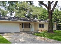 Charming single-story home with a two-car garage and a well-maintained lawn at 6255 Christina Ct, Orlando, FL 32810
