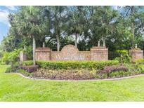 Wedgefield community sign with palm trees and manicured landscaping at the entrance at 2524 Albion Ave, Orlando, FL 32833
