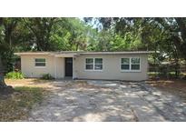 Charming single-story home featuring a well-maintained exterior and a welcoming entrance, plus a driveway at 5222 Montague Pl, Orlando, FL 32808