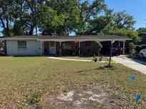 Charming single-story home featuring a carport and front lawn at 534 W Carole St, Lakeland, FL 33803